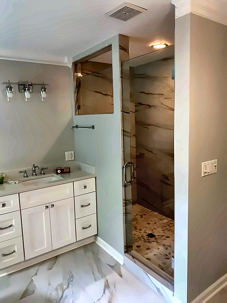 Finished bathroom with frameless glass shower