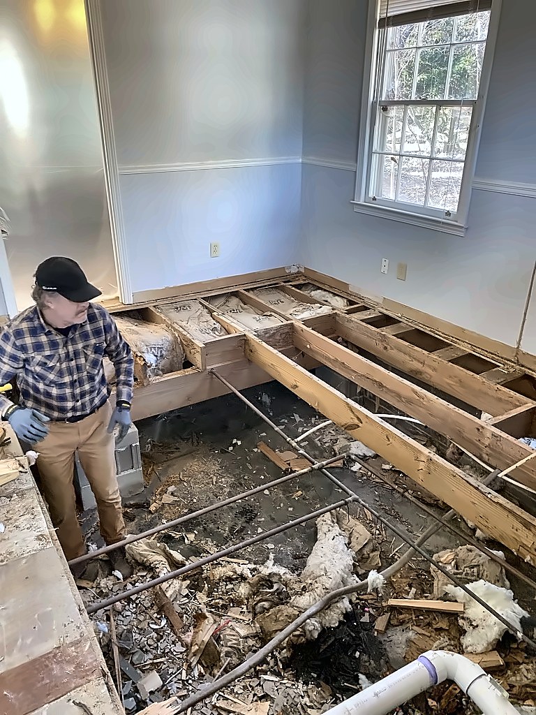 Floor opened down to the framing during demolition